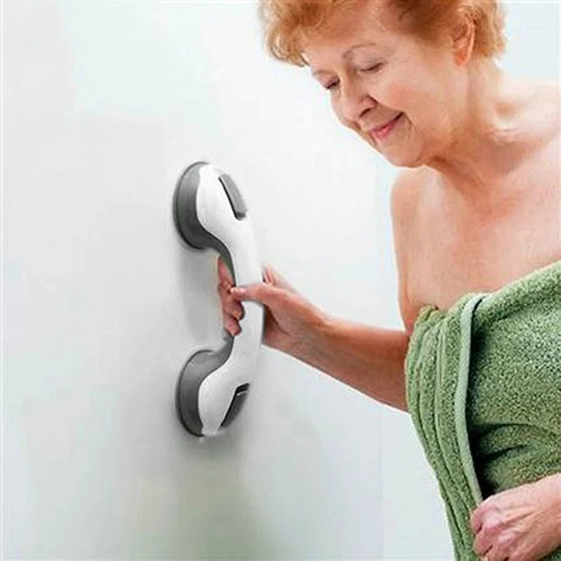 Suction cup grab bar on bathroom tile for elderly safety