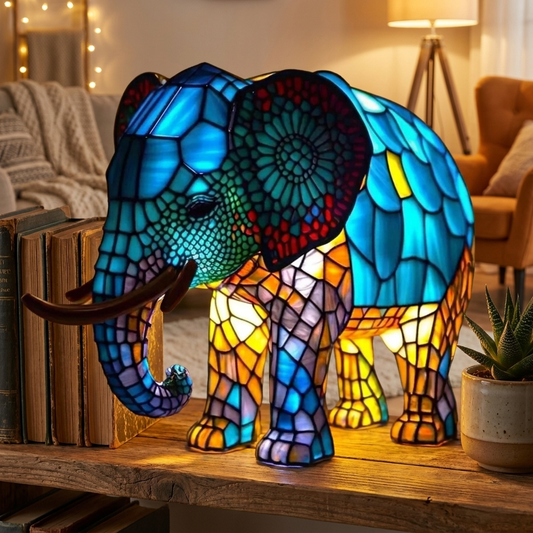 Colorful Elephant LED Mosaic Night Light illuminating a cozy living space, set beside books and a plant, by Worvane.